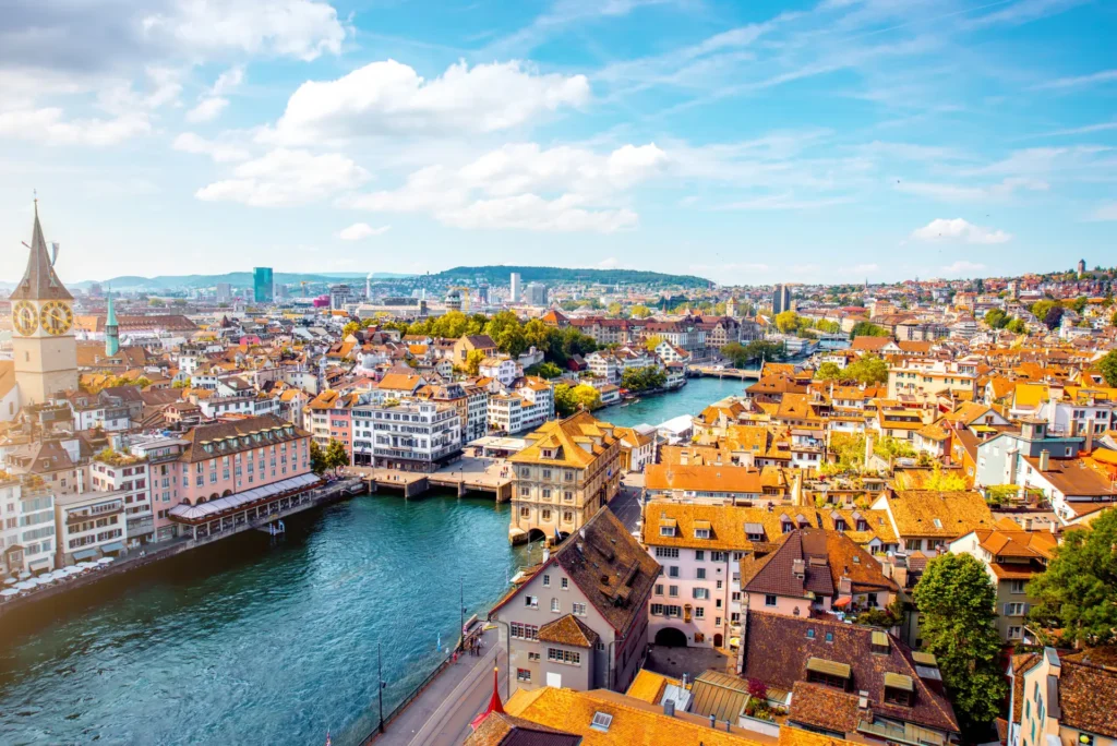 Aerial view of Zurich, Switzerland showcasing the vibrant architecture and Limmat River flowing through the city center.