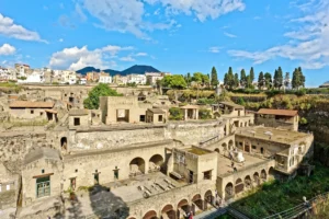 Panoramic view of the ancient ruins of Herculaneum with modern town in the background, near Naples, Italy