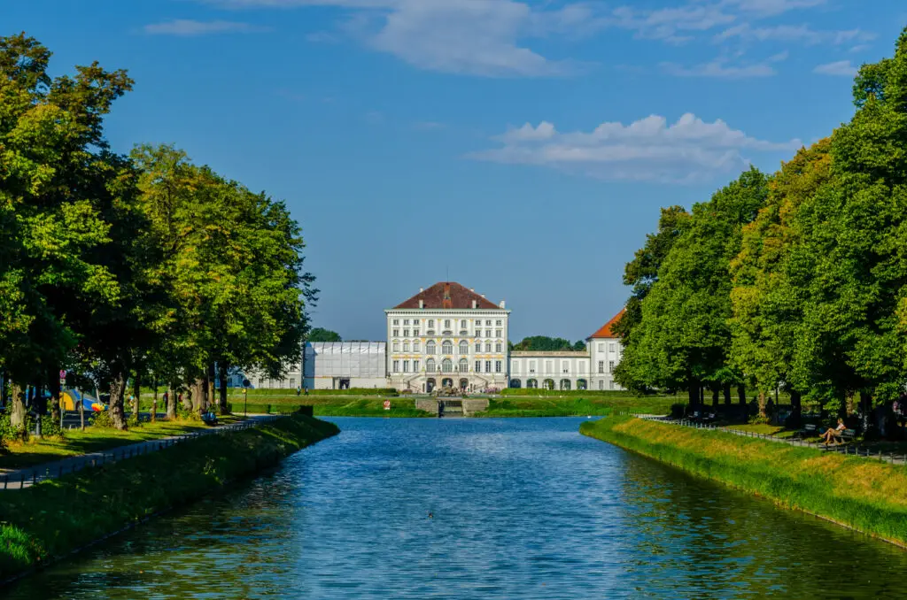 Nymphenburg Palace in Munich Germany with canal and gardens on a sunny day perfect for sightseeing and private tours