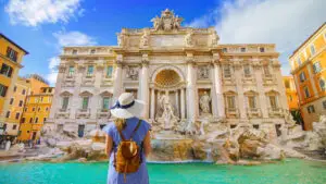 Tourist admiring the Trevi Fountain in Rome Italy on a sunny day during a European private tour