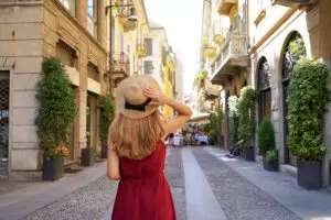 Stylish young woman walking through the Brera district in Milan, Italy, on a private Italy tour