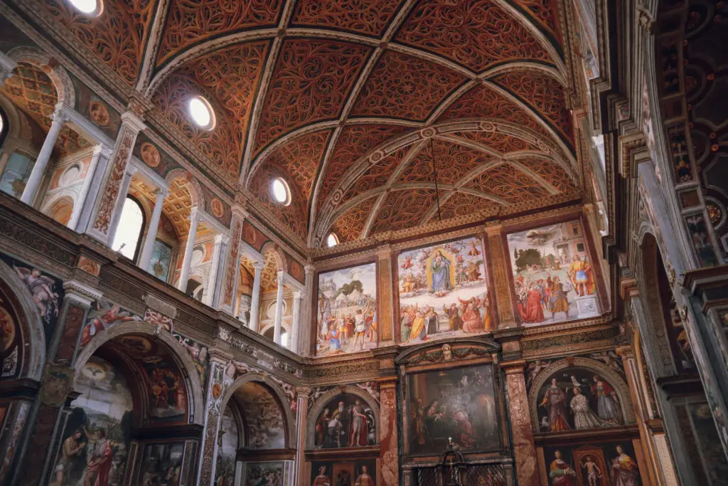 Colorful frescoes and ornate painted ceiling inside San Maurizio al Monastero Maggiore in Milan, Lombardy, Italy