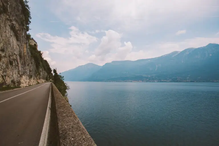Scenic road along Lake Garda with mountain views in Italy during summer