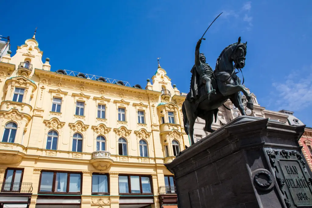 Statue of Count Ban Jelačić in Zagreb, Croatia, with historic architecture in Ban Jelačić Square