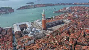 Aerial drone view of Saint Mark’s Square, St Mark’s Basilica and the Grand Canal in Venice, Italy