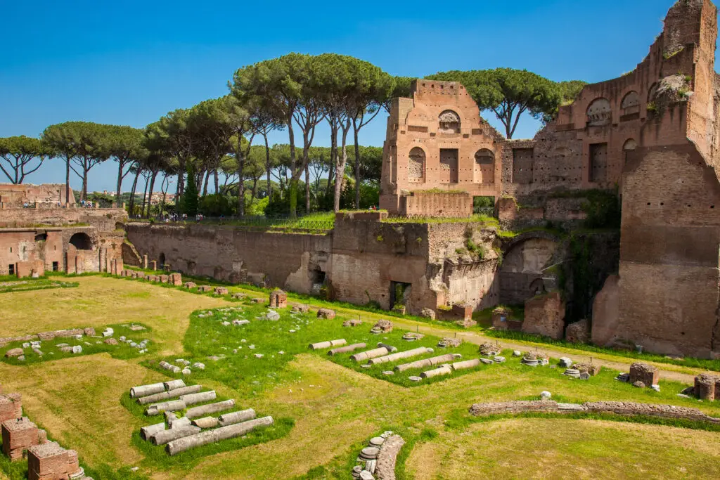 Stadium of Domitian ruins on Palatine Hill in Rome, Italy, with ancient brick walls and umbrella pine trees