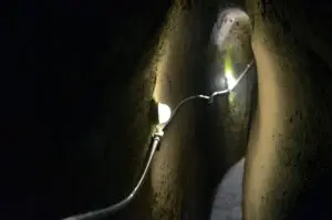 Narrow illuminated tunnel in Underground Naples, Italy, on a private Italy tour
