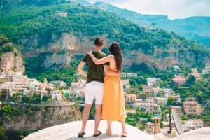 Couple enjoying scenic view of Positano on the Amalfi Coast in Italy during a private Italy tour