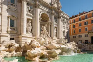 Trevi Fountain in Rome, Italy with Baroque sculptures and turquoise water on a sunny day