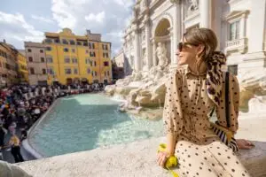 Woman visiting the Trevi Fountain in Rome, Italy on a private Italy tour