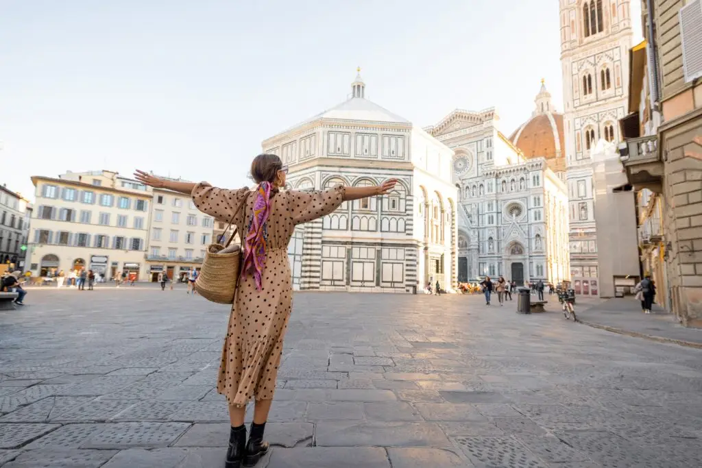 Woman enjoying view of Florence Duomo Cathedral in Piazza del Duomo, Florence, Italy on a private Italy tour