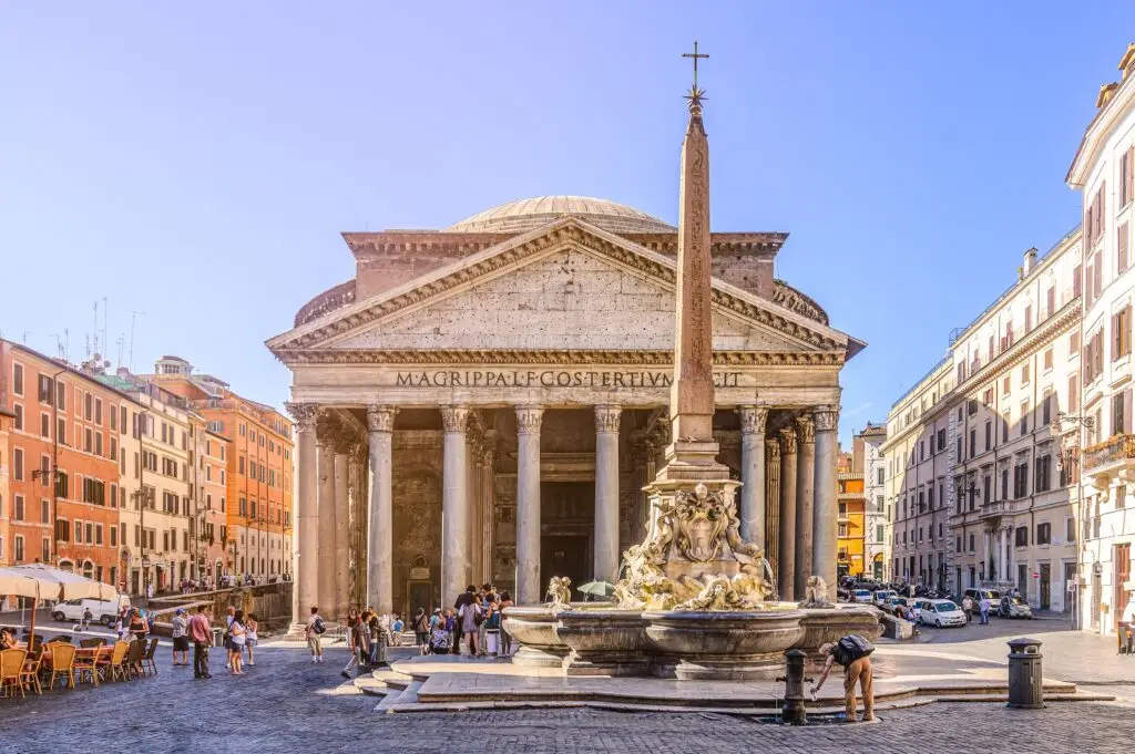 Pantheon and Fontana del Pantheon in Piazza della Rotonda, Rome, Italy with tourists in the historic square