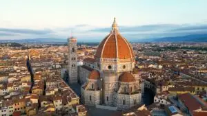 Aerial view of Florence Cathedral Duomo di Firenze and Giotto’s Bell Tower in Florence, Italy at sunset