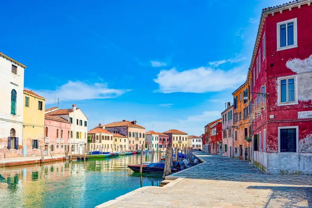 Colorful canal and historic buildings on Murano Island near Venice, Italy in the Venetian Lagoon
