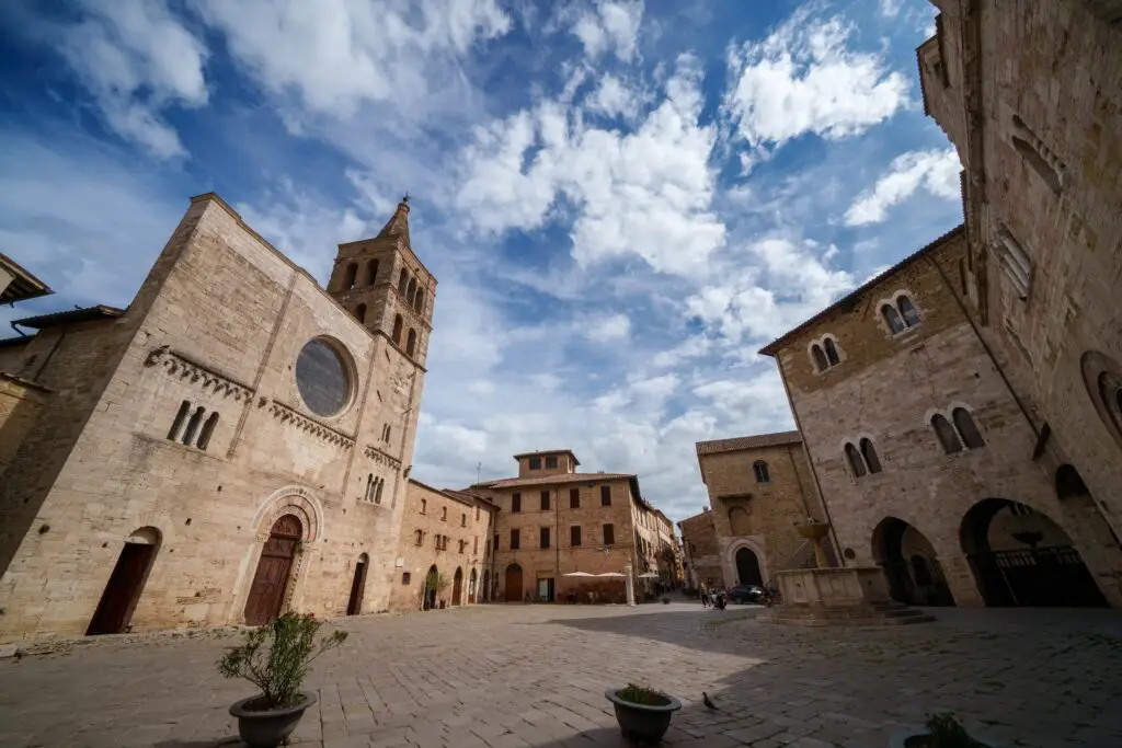 Historic Silvestri square with medieval buildings and church in Bevagna, Perugia Province, Umbria, Italy
