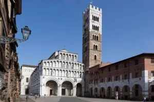 Duomo di San Martino cathedral and bell tower in Lucca, Tuscany, Italy under a clear blue sky