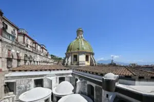 Dome of the Basilica of Santa Maria della Sanità above the Catacombs of San Gaudioso in Naples, Italy with Mount Vesuvius in the distance