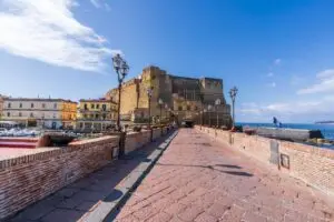 Castel dell’Ovo and Naples harbour waterfront view in Naples, Italy