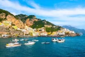 Beautiful view of Amalfi town on the Amalfi Coast, Italy, with colorful cliffside buildings and boats in the harbor