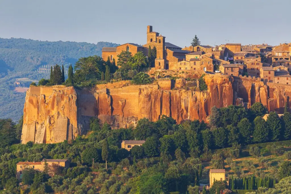 Hilltop view of historic Orvieto, Italy with medieval stone buildings on volcanic cliffs in Umbria