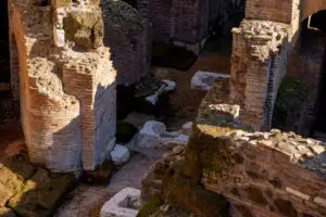 Ancient brick ruins and underground chambers of the Colosseum amphitheatre in Rome, Italy