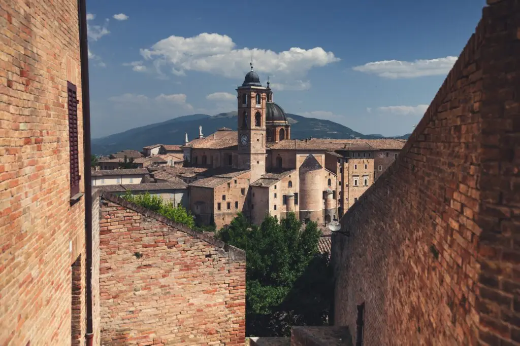 Historic Urbino city and UNESCO World Heritage Site in Le Marche, Italy, with cathedral dome and brick rooftops
