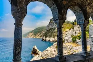 Sea view through historic stone arches in Portovenere, La Spezia, Liguria, Italy