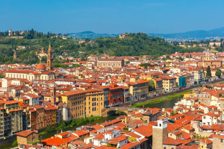 Panoramic view of Florence Italy with River Arno, Oltrarno rooftops, bridge and Santo Spirito church in Tuscany