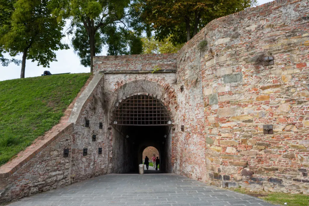 Historic city walls and arched gate entrance in Lucca, Tuscany, Italy