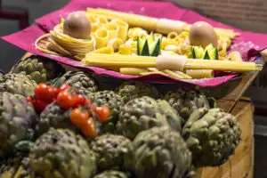 Fresh pasta display with artichokes and tomatoes at a local restaurant in Rome, Italy