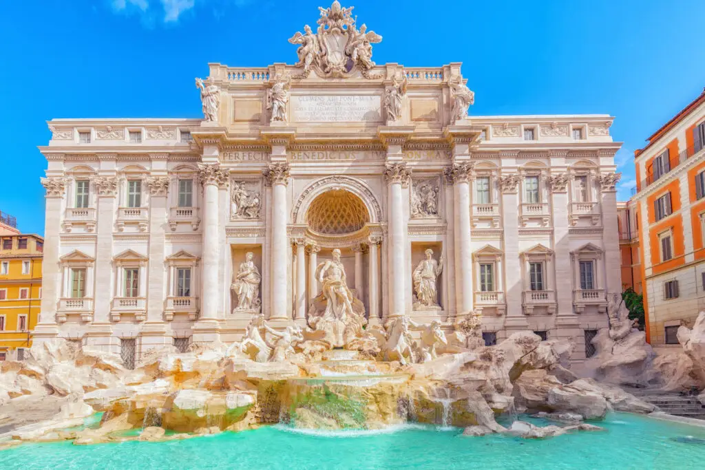 Trevi Fountain in Rome Italy with Baroque sculptures and turquoise water on a sunny day
