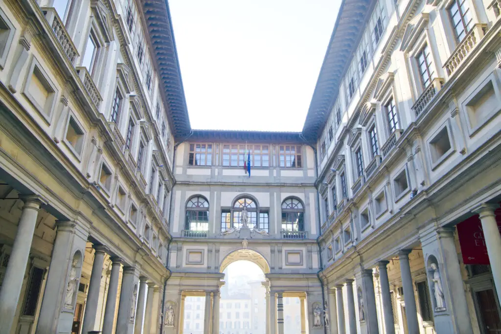 Uffizi Gallery courtyard in Florence, Italy, with Renaissance architecture and arched portico for private Italy tours